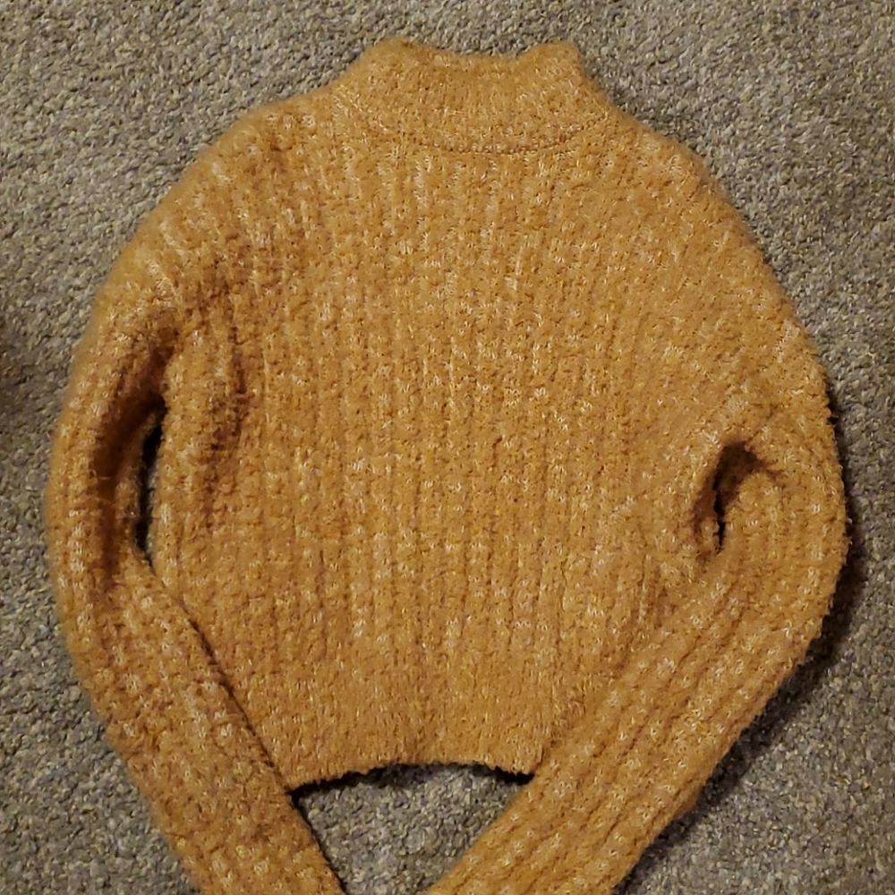 Yellow turtleneck sweater
